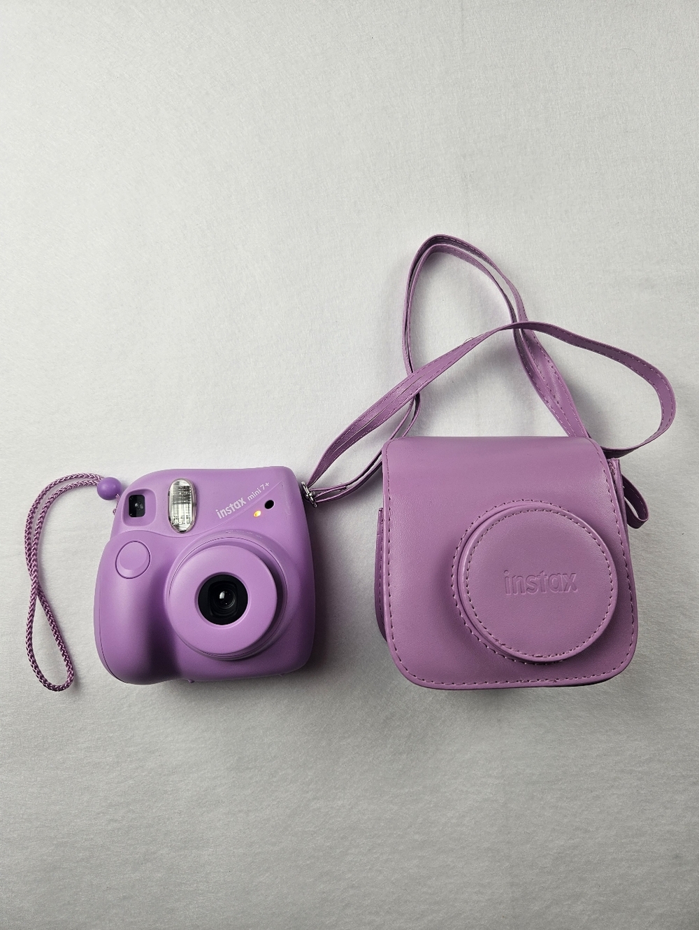 Fujifilm Instax Mini 7+ Instant Film Camera in Lavendar with Matching Case.